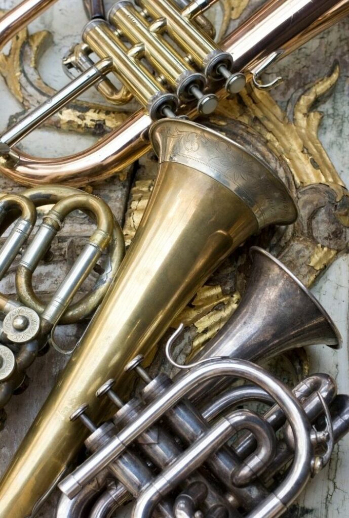 The trumpets differ in appearance due to different materials and lacquer finishes. 